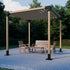 Wooden pergola with outdoor furniture on a paved patio