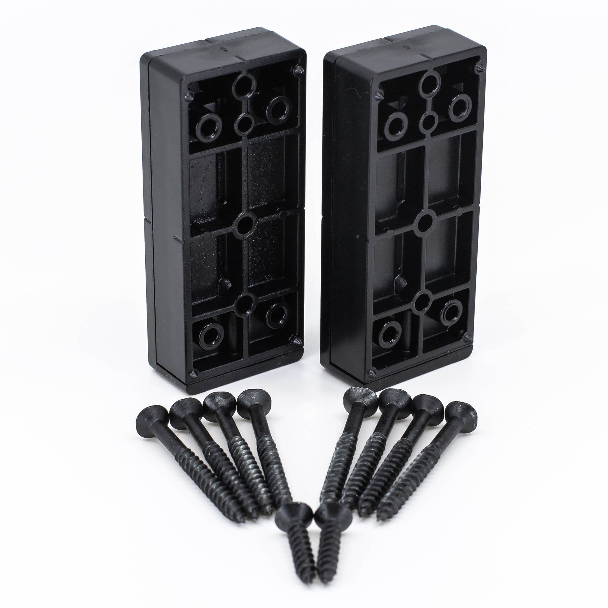 Two black polycarbonate deck rail connectors with screws laid out in front of them.