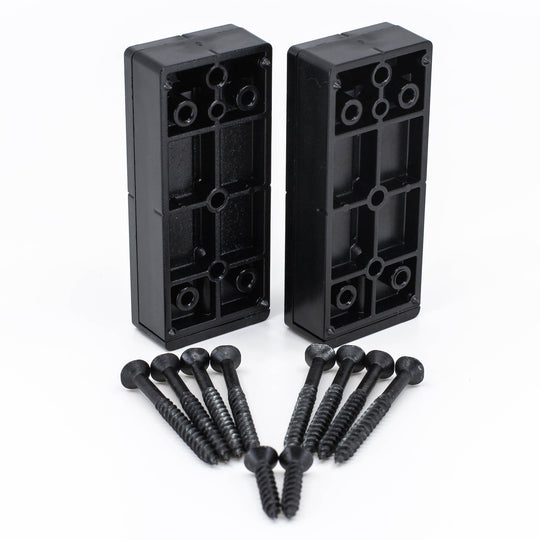 Two black polycarbonate deck rail connectors with screws laid out in front of them.